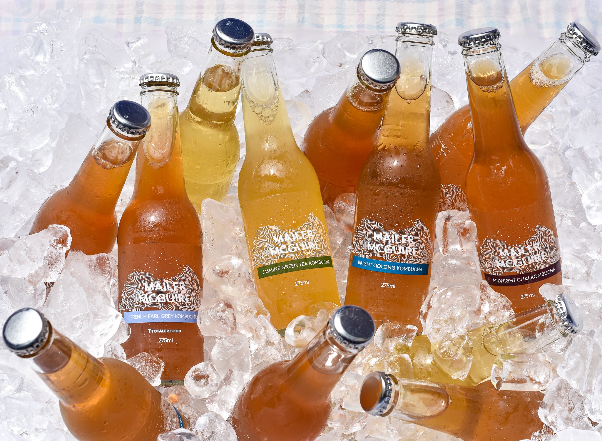 Mailer McGuire Kombucha Sampler Mixed Pack chilling in an ice bucket ready to crack open